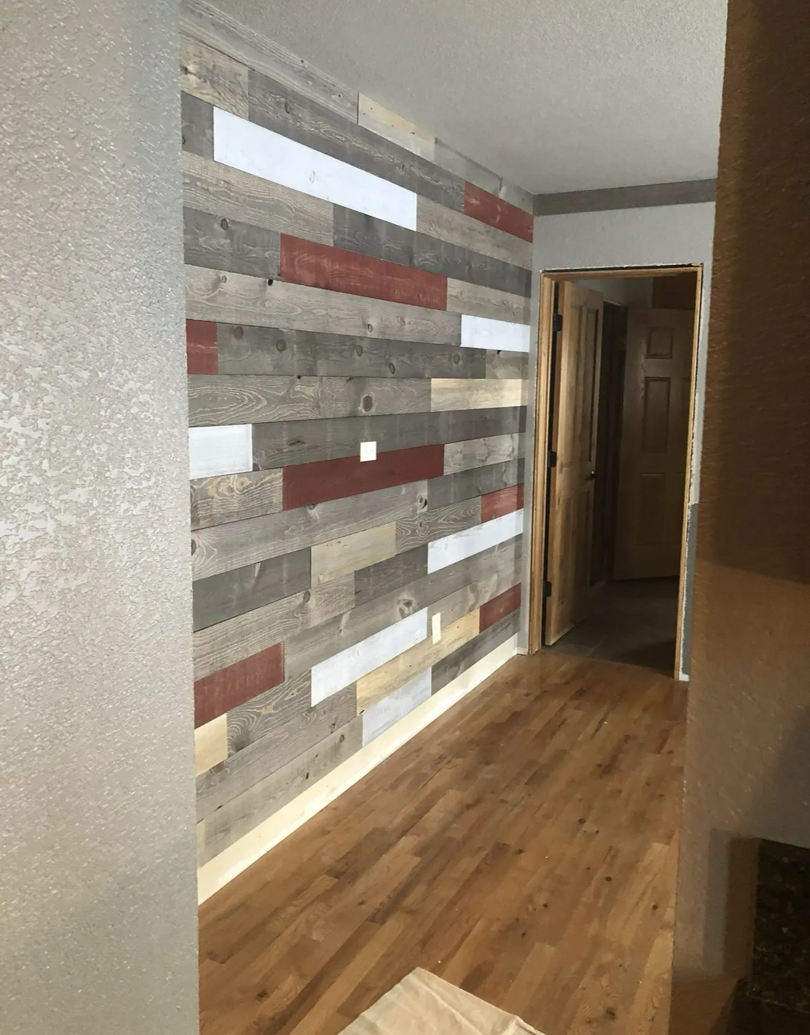Reclaimed wood feature wall in the hallway