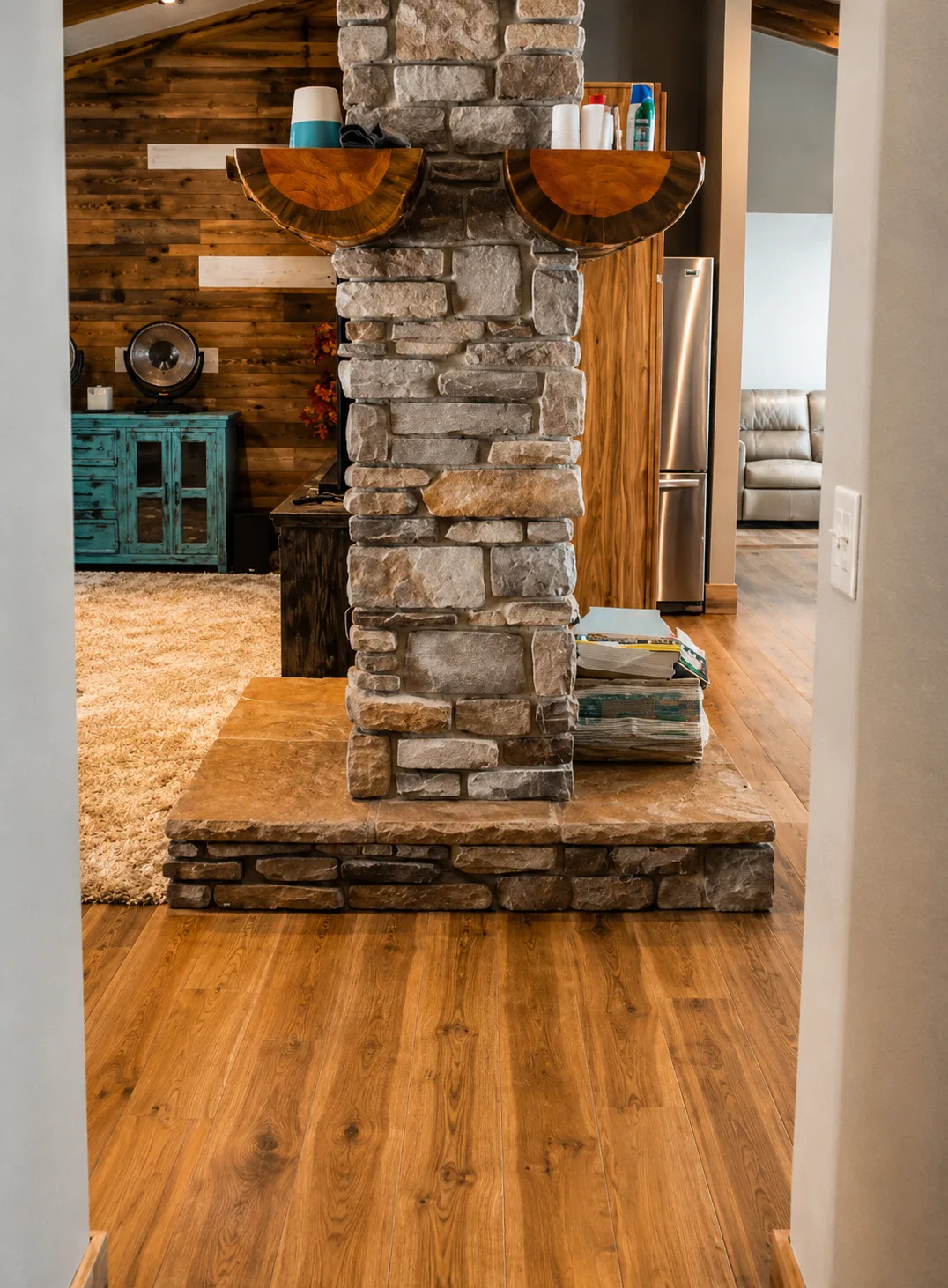 Stone column and hardwood floors